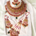 Bride wearing designer jewelry with a traditional Pakistani wedding outfit