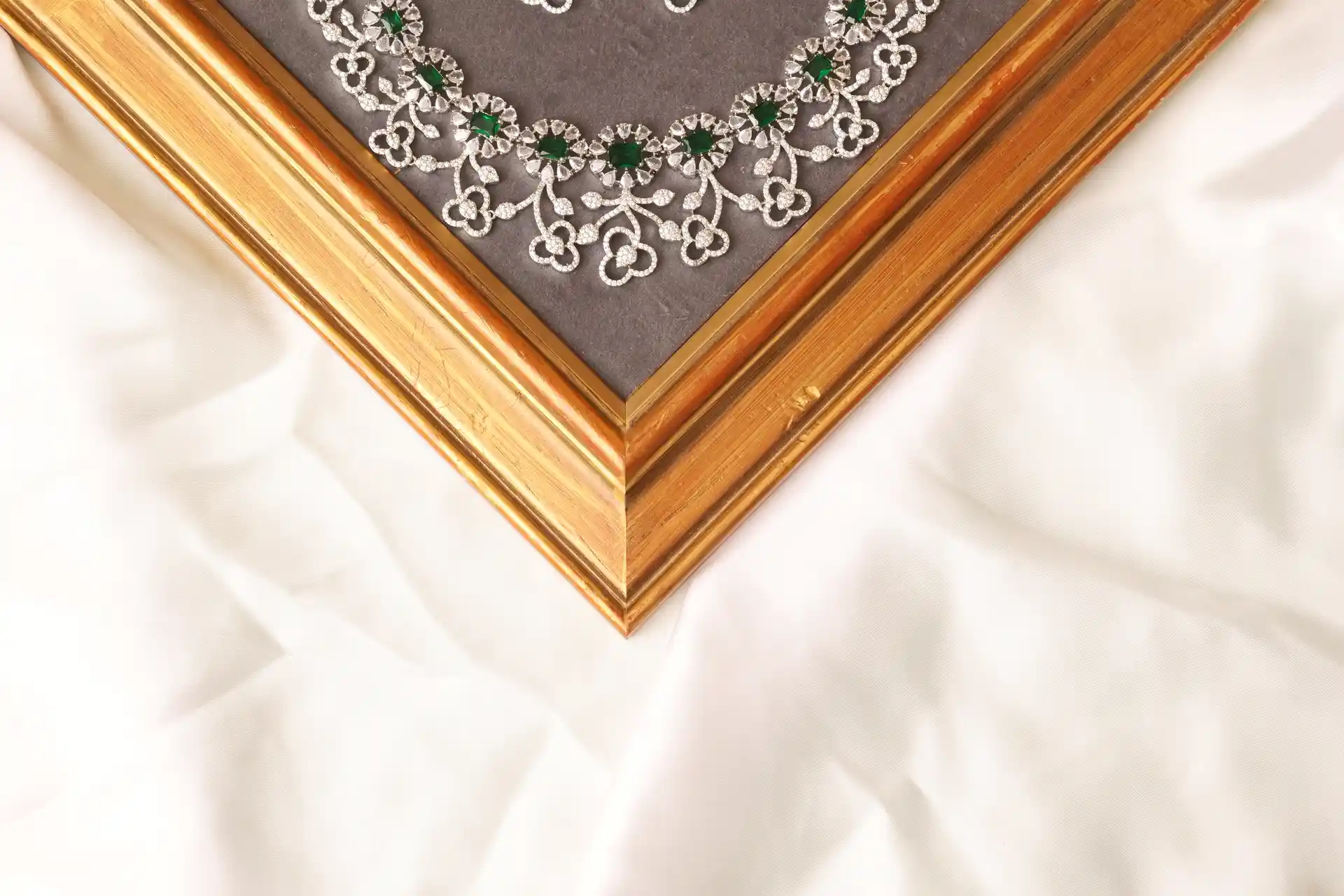 Close-up of Cora Green Floral Necklace Showing Clover Link Design and Emerald-Tone CZ Stones