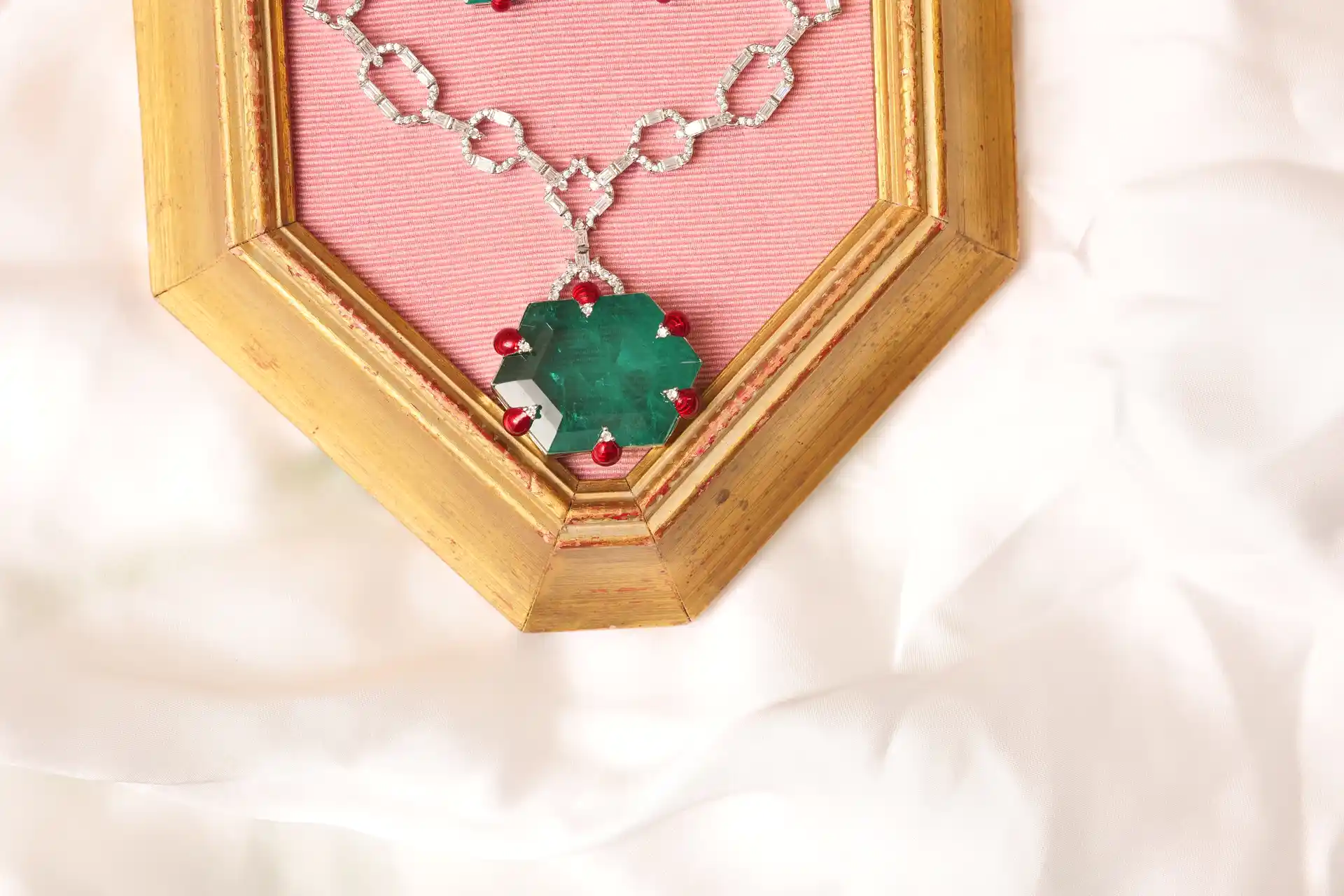 Close-up of Hexagonal Synthetic Emerald Pendant with Coral Bead Accents on Elara Green Mala Necklace