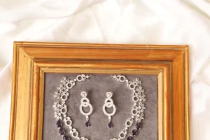 Close-up of Voya Double Layer Necklace Floral Chain and Matching Interlocking Circle Earrings