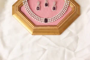 Close-up of Miraje Purple Three-Strand CZ Tennis Necklace and Emerald-Cut Amethyst Pendant