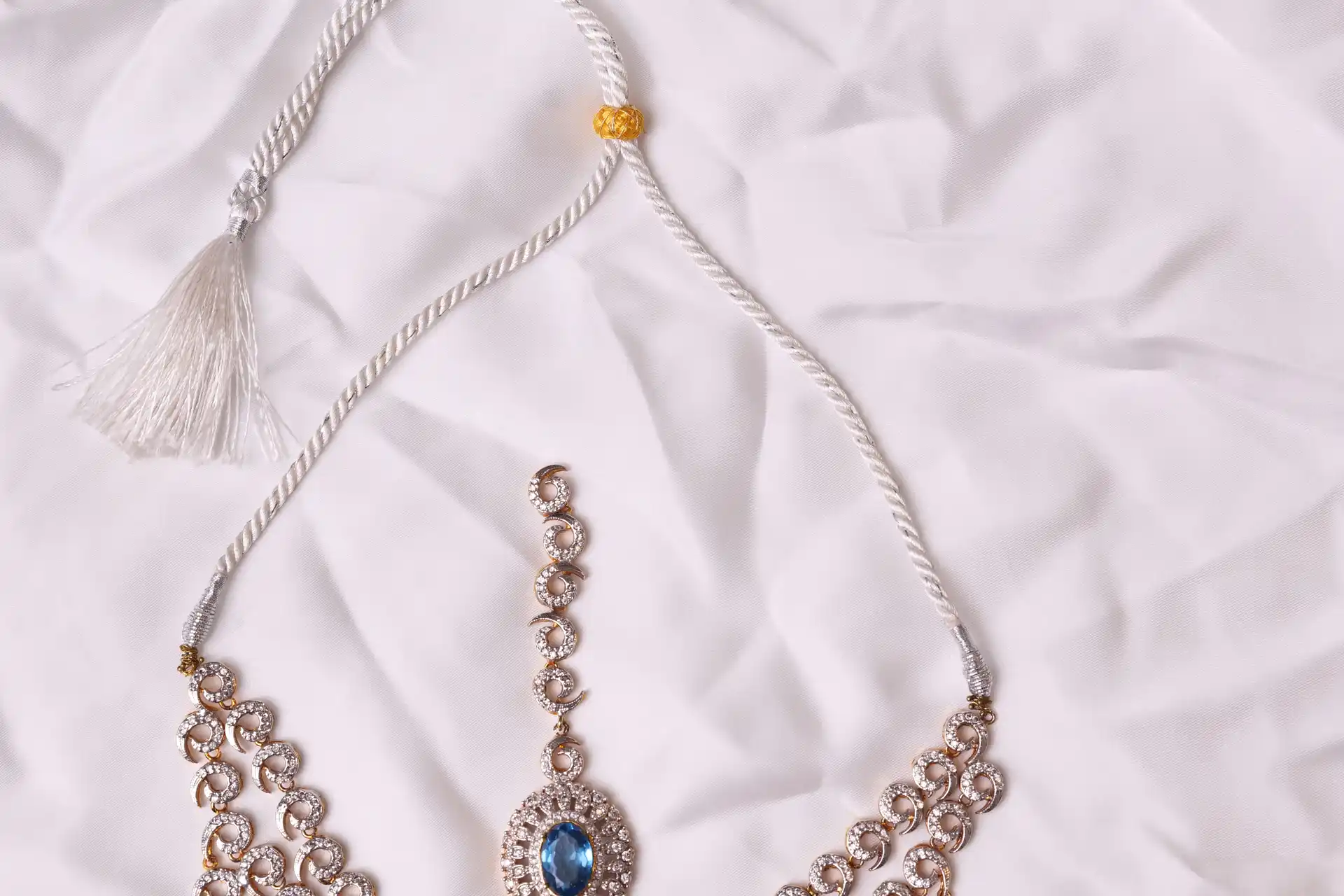 Close-up of Riva Aquamarine Bridal Set Maang Tikka and Adjustable Tassel Closure