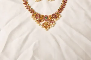 Close-up of Mehrunnisa Kundan Necklace Peacock Motif Pendant with Pearl Drop Fringe