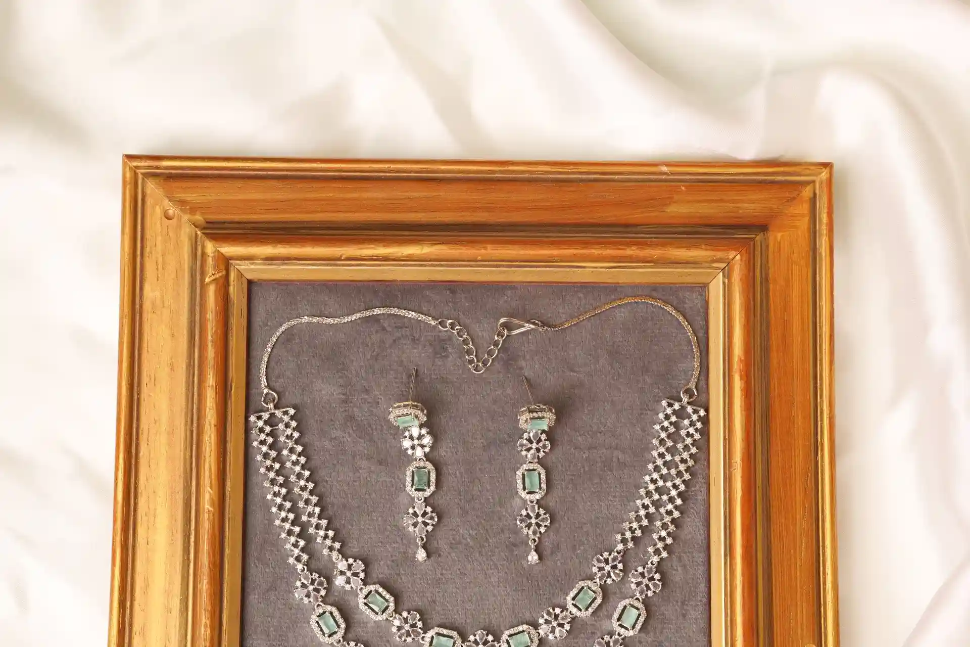 Close-up of Muse Mint Necklace Octagon Link Strand with Mint Green Stones in CZ Frame