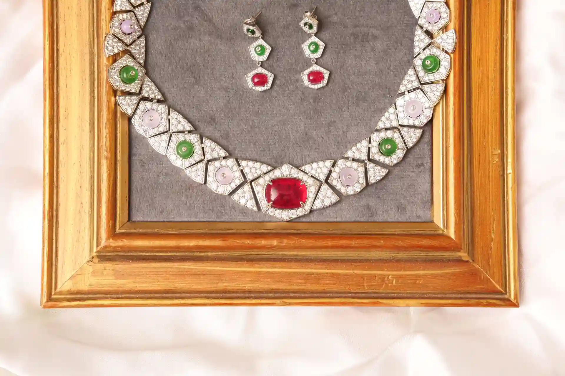 Close-up of Mira Necklace Ruby, Lilac, and Emerald Cabochon Detail with Matching Drop Earrings