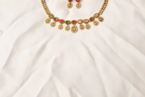 Close-up of Taj Noor Navratna Necklace Showing Nine Multi-Color Stones and Matching Earrings