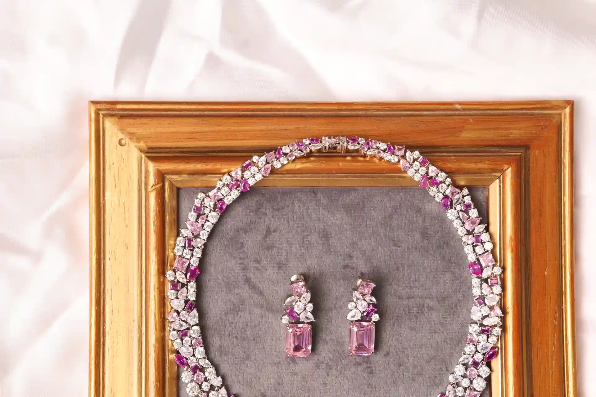 Close-up of Sola Pink Topaz Necklace Clasp and Matching Emerald-Cut Pink Topaz Earrings