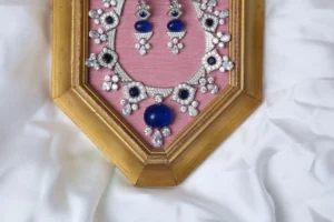 Close-up of Nava Necklace Oval Sapphire-Blue Cabochon Centerpiece and Matching Drop Earrings