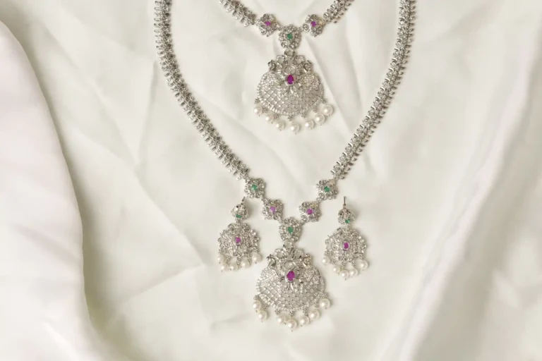 Close-up of Yara Necklace Filigree Pendant with Ruby, Emerald, and Pearl Fringe Detailing