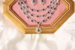 Close-up of Zhen Necklace Three Layers with Emerald-Cut Sapphire Stones and Marquise Pendant