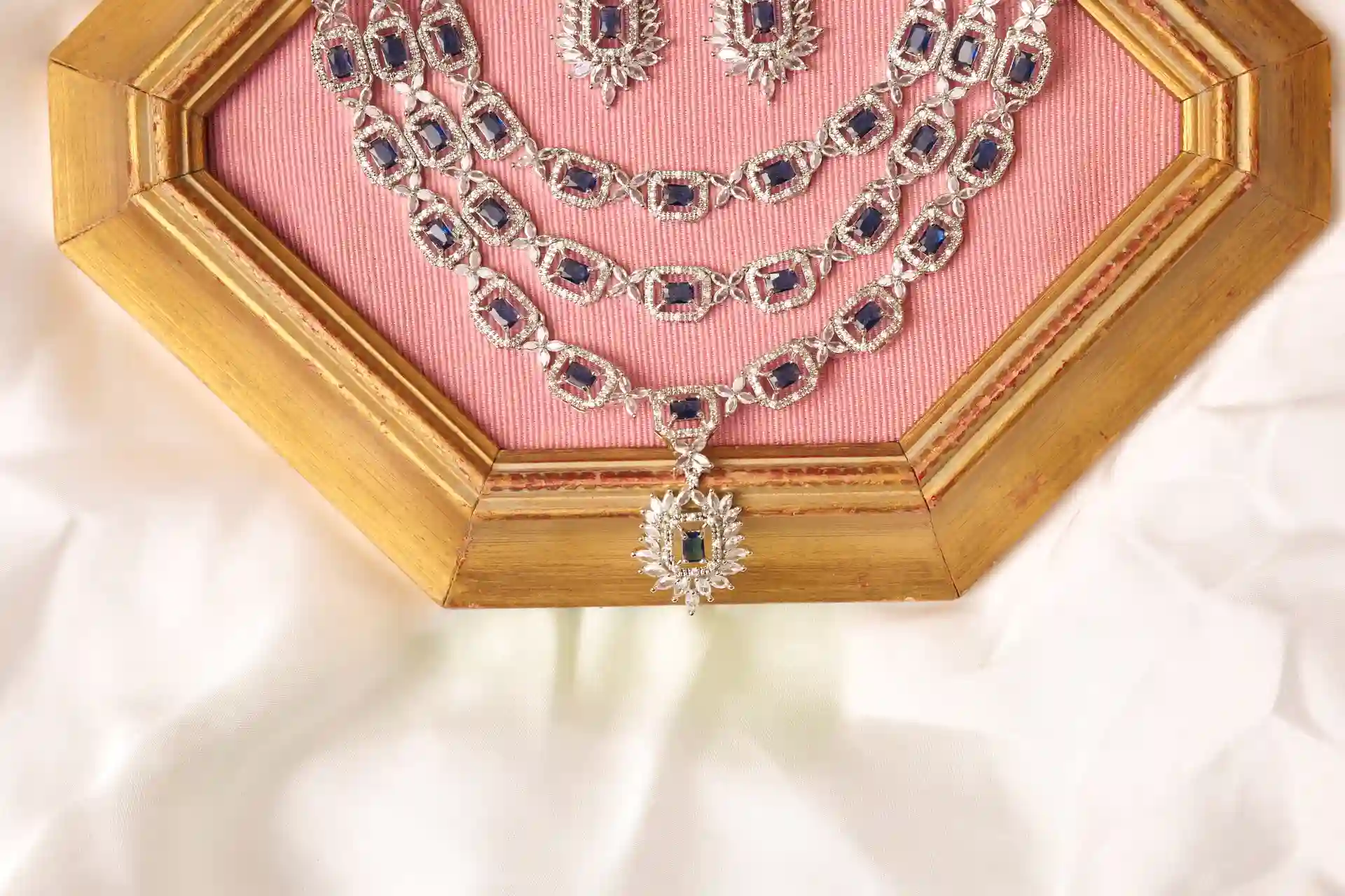 Close-up of Zhen Necklace Three Layers with Emerald-Cut Sapphire Stones and Marquise Pendant