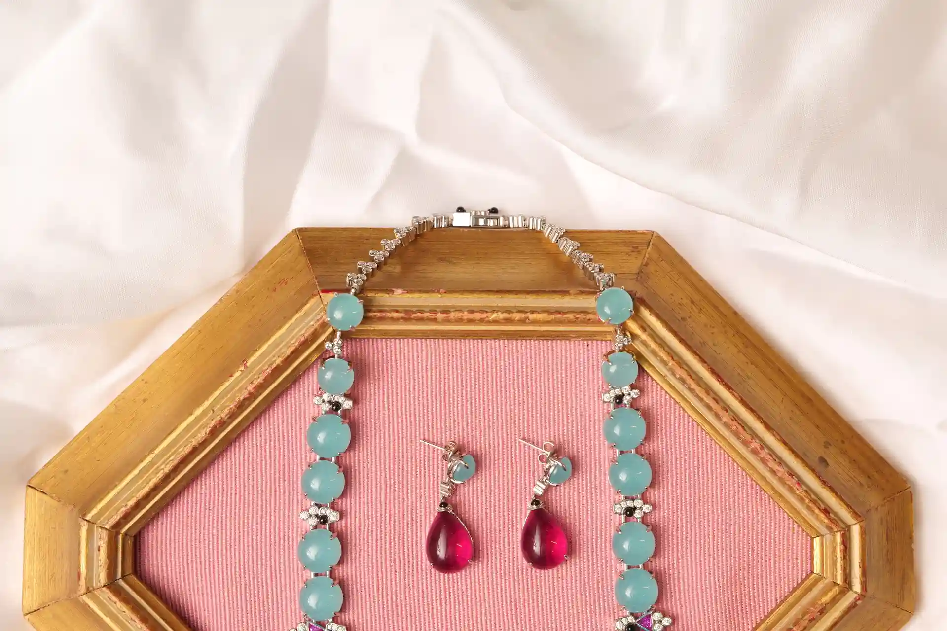 Close-up of Vela Necklace Clasp and Matching Pink Tourmaline Teardrop Drop Earrings
