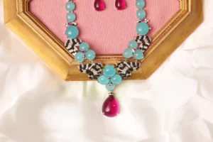 Close-up of Vela Necklace Pavé Fan Motif and Pink Tourmaline Teardrop Pendant